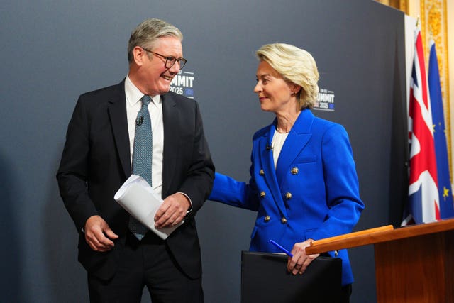 Sir Keir Starmer and Ursula von der Leyen smiling while standing next to each other