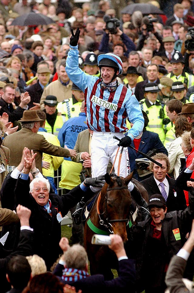 Jim Culloty on Best Mate and owner Jim Lewis (bottom left) celebrate their third consecutive win in the Cheltenham Gold Cup at the Cheltenham Festival