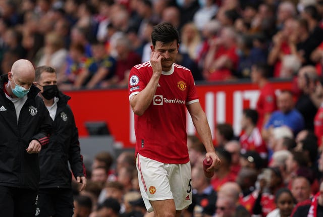 Harry Maguire leaves the pitch after suffering an injury