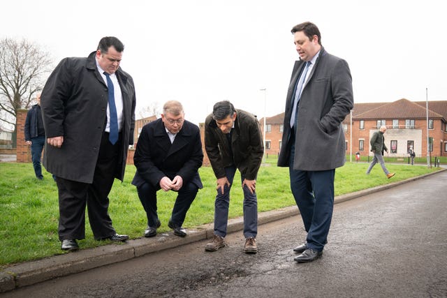 Prime Minister Rishi Sunak with Darlington Council leader Jonathan Dulston, far left, Tees Valley mayor Ben Houchen, far right, and Darlington MP Peter Gibson, second from left, in Firth Moor during a visit to Darlington, County Durham
