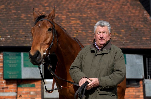 Bravemansgame with trainer Paul Nicholls during a visit to Manor Farm Stables