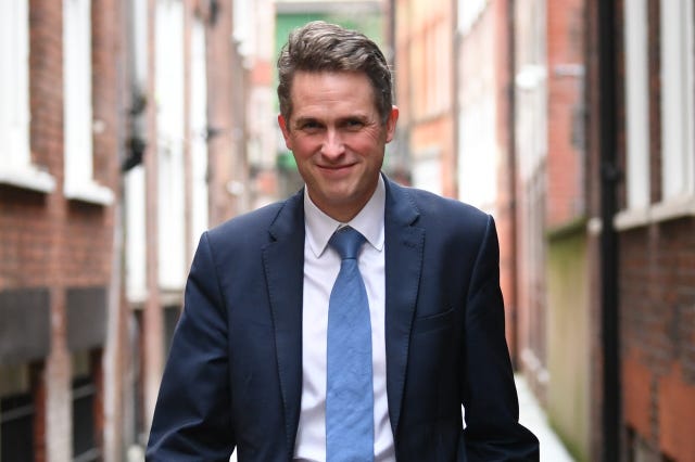 Conservative MP Sir Gavin Williamson walking in the street