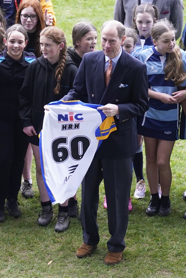 The Duke of Edinburgh is presented with a number 60 rugby shirt, ahead of his 60th birthday, during a visit to Headingley Stadium in Leeds to watch rugby trials and take part in an awards ceremony