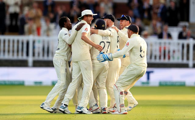 Joe Denly, centre, was mobbed after his fine catch accounted for Australia captain Tim Paine as England pushed for victory on day five