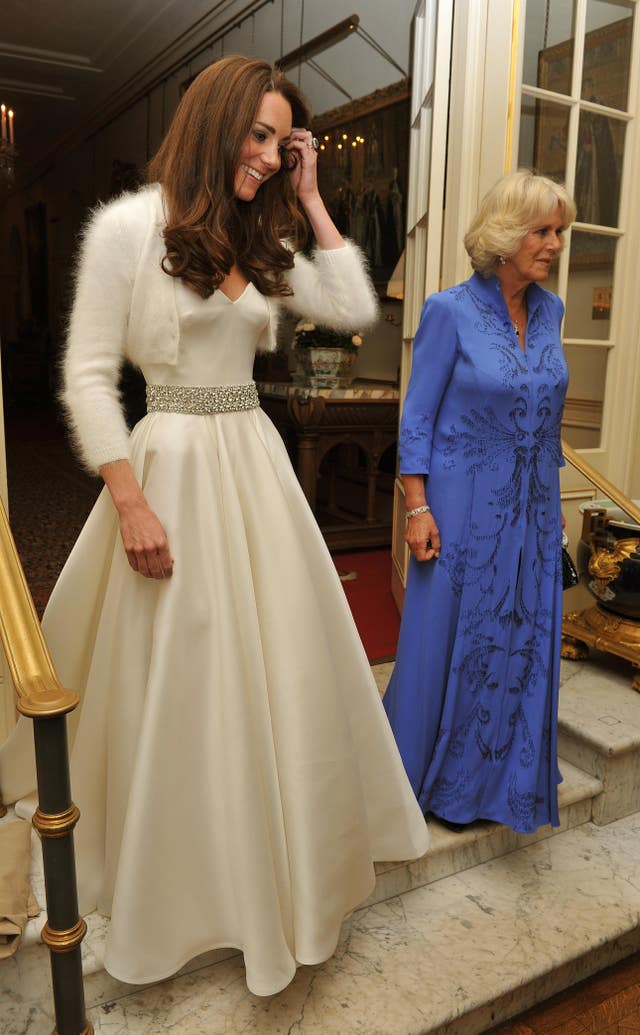 The Duchess of Cambridge in her second evening wedding dress, with the Duchess of Cornwall (John Stillwell/PA)