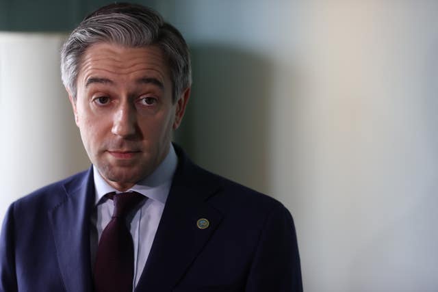 Tanaiste Simon Harris looks at the camera during a photoshoot at the British Irish Council summit
