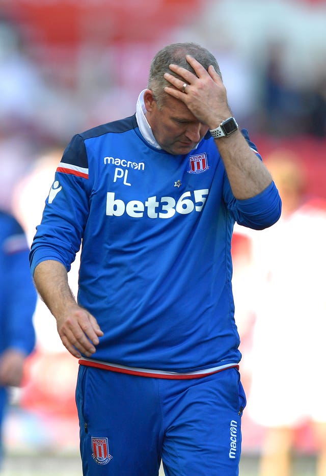 Stoke boss Paul Lambert holds his head in his hands after the game 