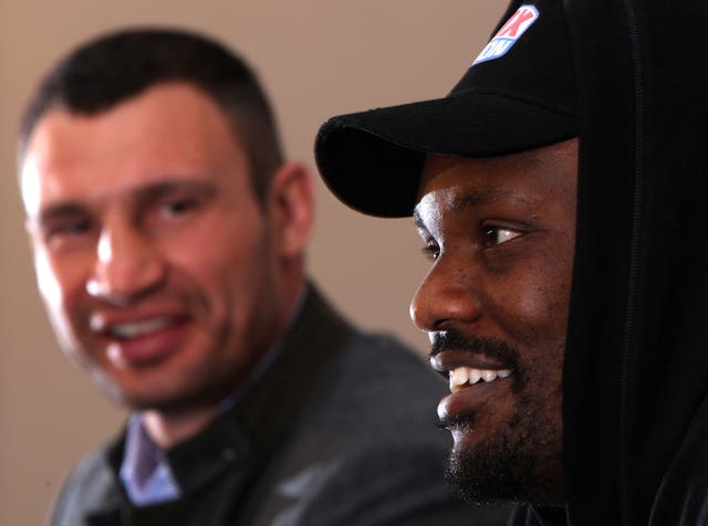 All smiles for Chisora, right, and Klitschko during a London press conference, but things would soon turn ugly 
