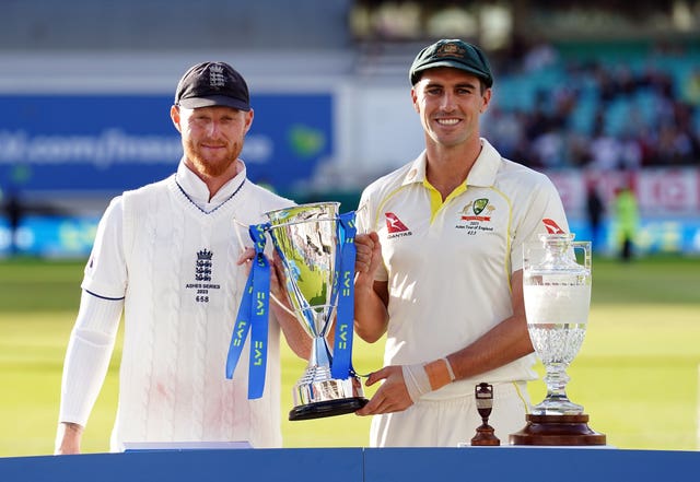 Ben Stokes (left) and Pat Cummins (right) hold the Ashes trophy after a drawn series in 2023.