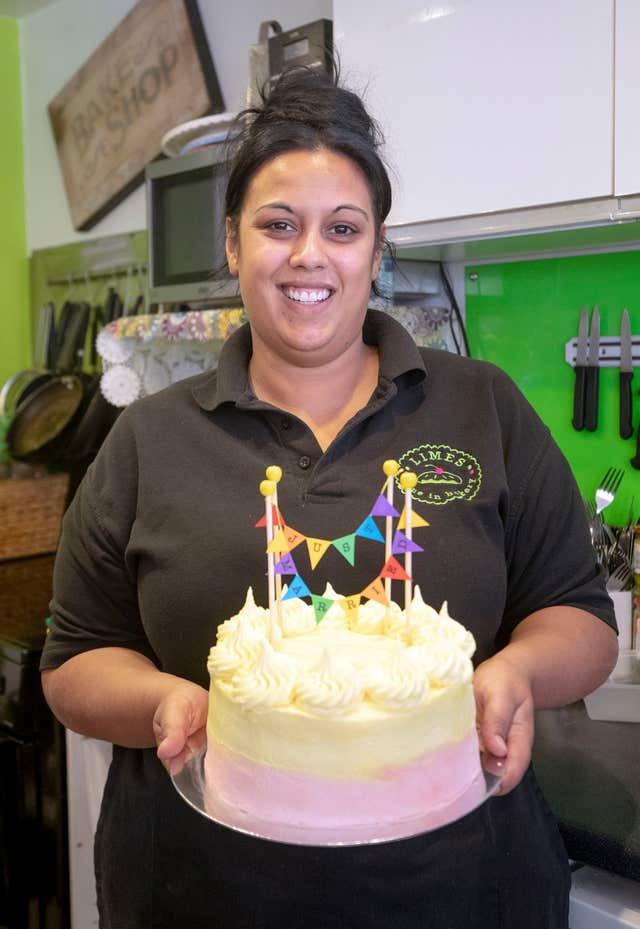 Stephanie Methven from Limes Dine Bakery in Windsor, with a homemade cake ahead of the royal wedding (Steve Parsons/PA)