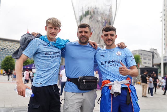 Manchester City fans Will Hustle, Stephen Cavanagh, and his son Dillion Cavanagh in Taksim Square, Istanbul, ahead of Saturday’s Champions League final between Manchester City and Inter Milan at the Ataturk Olympic Stadium 