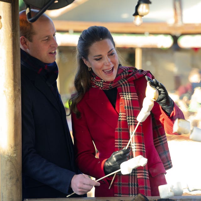 The Duke and Duchess of Cambridge toast marshmallows during a visit to meet students at the ‘Christmas at the Castle’ event held at Cardiff Castle to hear how they have been supported with their mental health during lockdown, on the final day of a three-day tour across the country