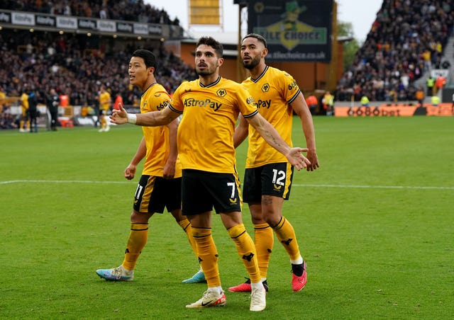 Hwang Hee-Chan (left) celebrates