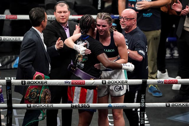 Claressa Shields, left, and Savannah Marshall hug after the fight