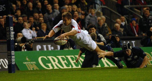 Wilkinson dives over for his try in the contest at Twickenham (David Jones/PA).