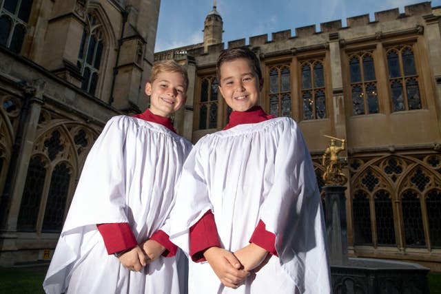(left to right) Leo Mills, 12, and Alexis Sheppard, 11, choristers who will take part in the royal wedding. Steve Parsons/PA Wire