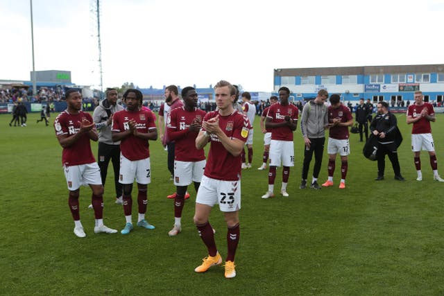 Northampton players applaud travelling supporters