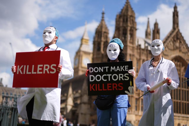 Campaigners protest outside Parliament
