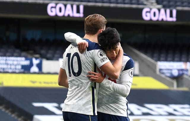 Harry Kane, left, celebrates with Son Heung-min after opening the scoring from the penalty spot against Leeds
