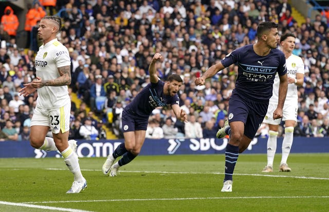 Man City put four past Leeds to take top spot right back from Liverpool