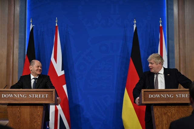 Boris Johnson (right) and German Chancellor Olaf Scholz during a press conference in the Downing Street briefing room 