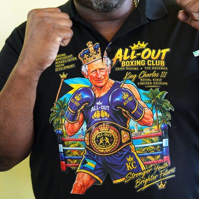 Charles tickled by boxing club’s T-shirt depicting him as king of the ring