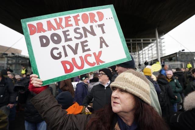 Farmers protest outside the Senedd in Cardiff over planned changes to farming subsidies (Andrew Matthews/PA)