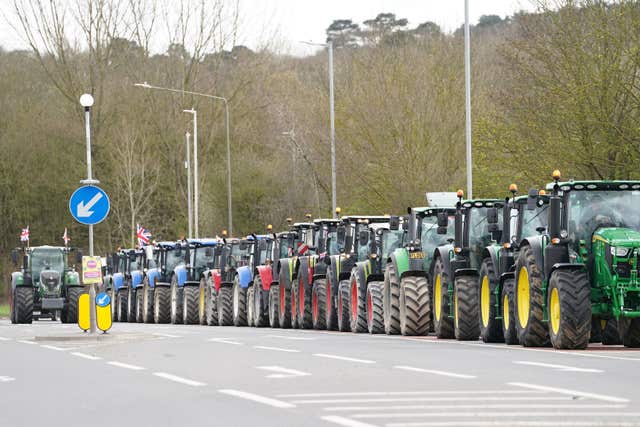 A convoy of farmers in tractors gather on the A20, near Wrotham, in Kent