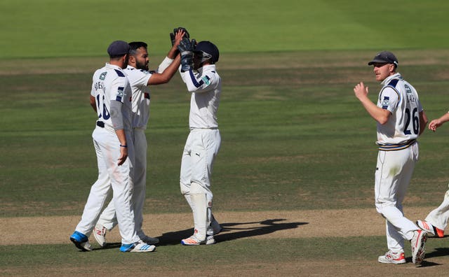 Azeem Rafiq, second left, celebrates taking the wicket of Middlesex's Nick Gubbins during his playing days with the club 