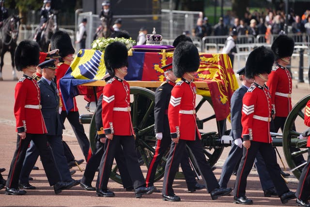 The Queen's coffin was carried by gun carriage to Westminster Hall for the lying in state