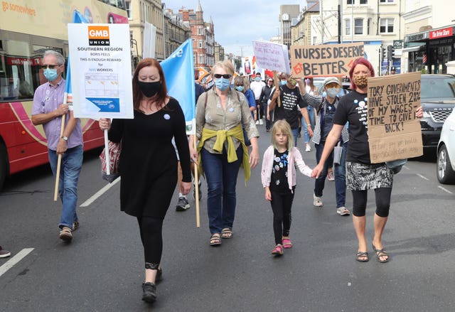 Demonstrators take part in a march in Brighton 