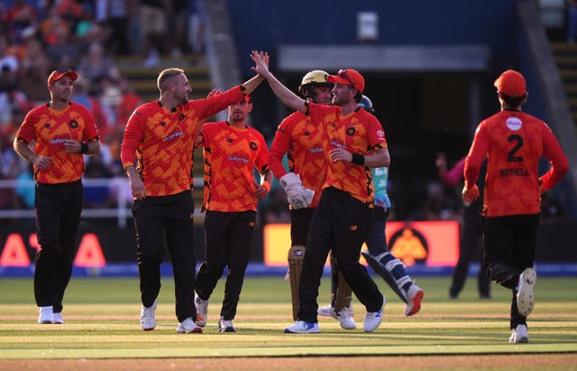 Birmingham Phoenix men's team celebrate a wicket.