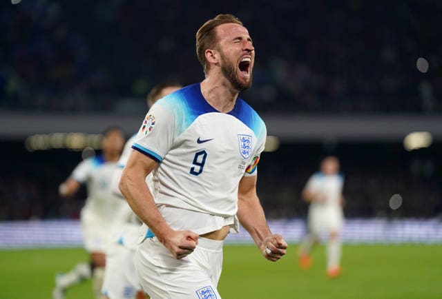 Harry Kane celebrates setting England's goalscoring record