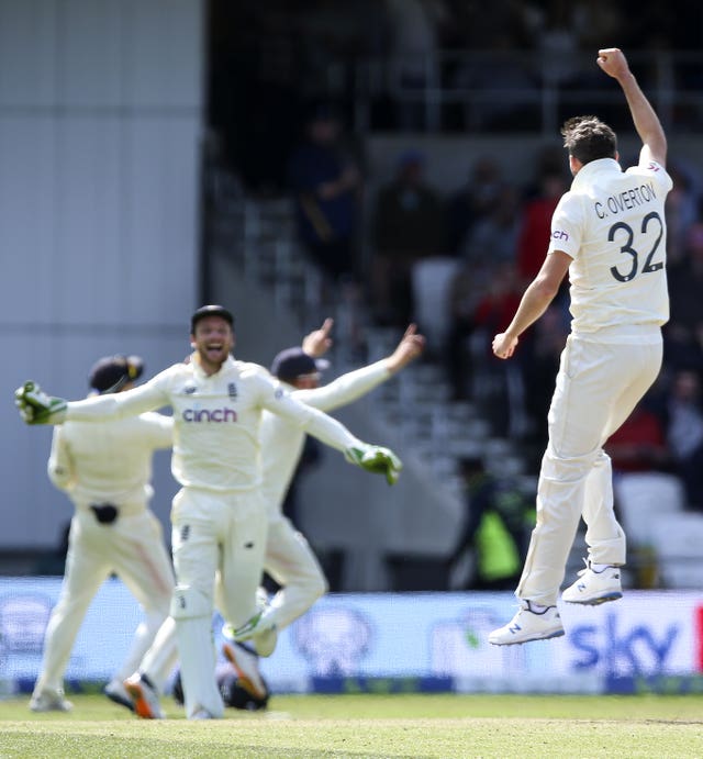 England's Craig Overton (right) celebrates after taking the wicket of India's Mohammed Siraj to win the third Test at Headingley