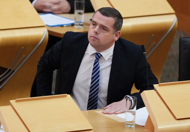 Douglas Ross sitting in Holyrood's main chamber