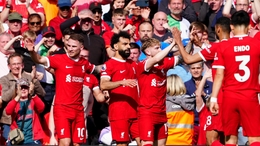 Liverpool’s Mohamed Salah (centre) is congratulated by his team mates after scoring the first goal of the game during the Premier League match at Anfield, Liverpool. Picture date: Sunday May 5, 2024.