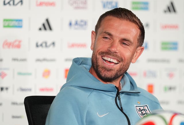 England’s Jordan Henderson laughs during a press conference