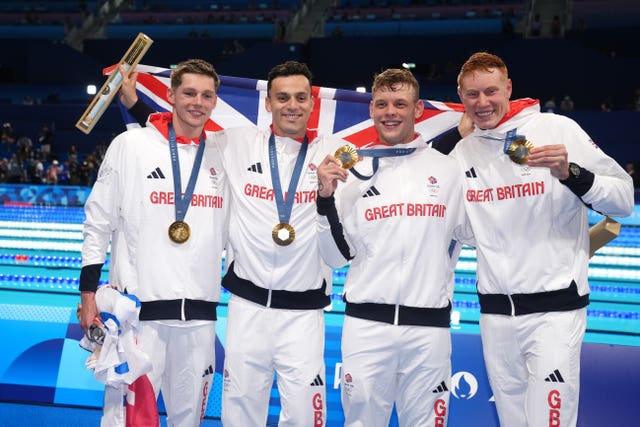 Duncan Scott, James Guy, Matt Richards and Tom Dean celebrate with their Olympic gold medals