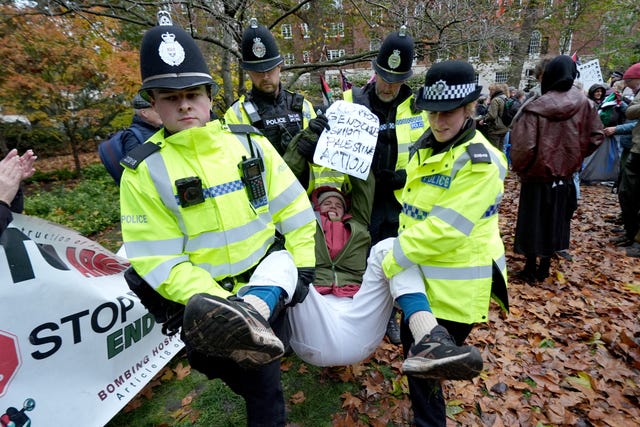 Police remove people from the Defend Our Juries protest in support of Palestine Action at The Peace Garden, Tavistock Square, central London