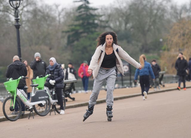 A woman rollerblades through central London 