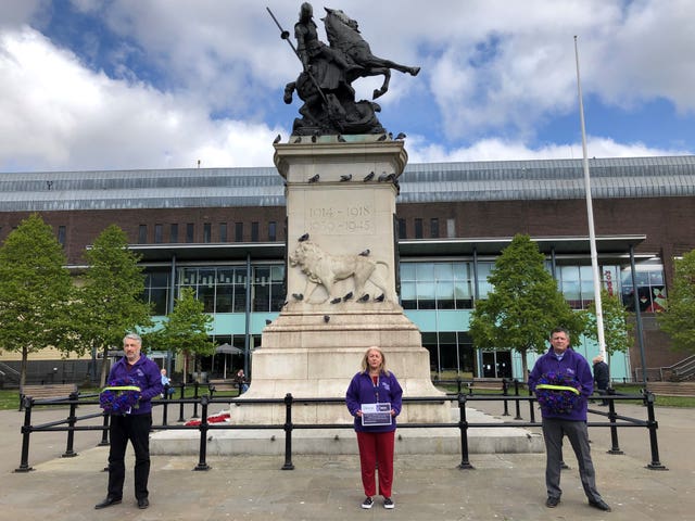 Unison representatives Joe McAtominey, Linda Hobson and Michael Barclay before they laid two wreaths at the War Memorial in Old Eldon Square, Newcastle, for key workers in the fight against Covid-19