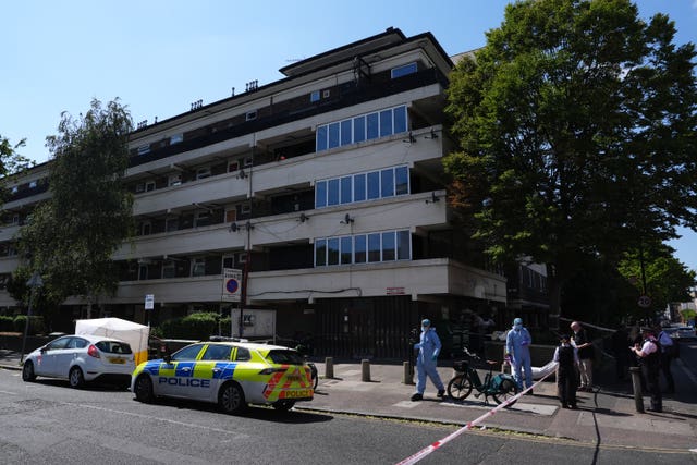 Officers in forensic suits at the scene outside Lopez House on Willington Road 
