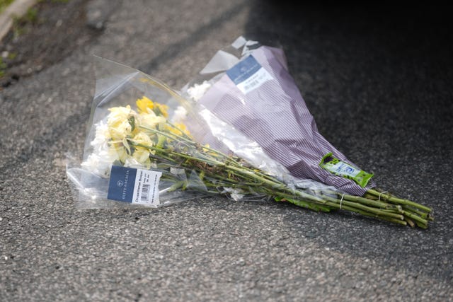 Flowers left at the scene on Russell Close in Heckmondwike