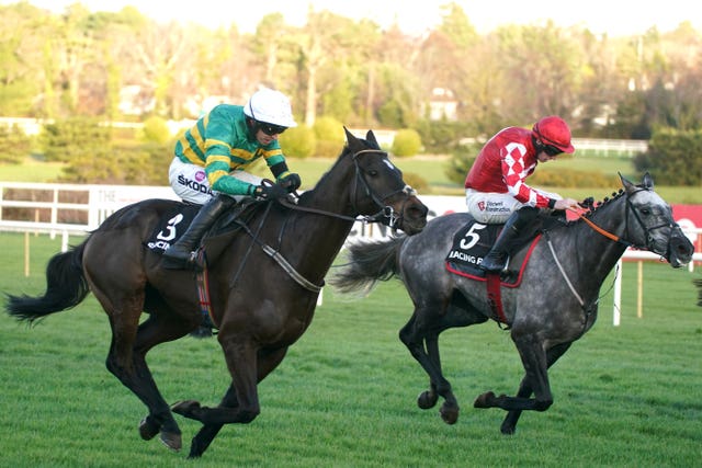 Saint Roi ridden by jockey Mark Walsh (left) wins the Brand New Racing Post App Novice Chase at Leopardstown