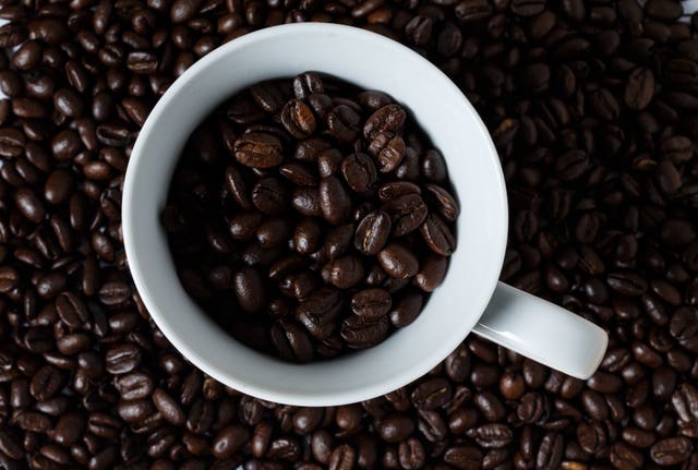 Coffee beans in a cup