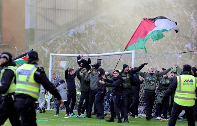 Celtic fans invade the pitch