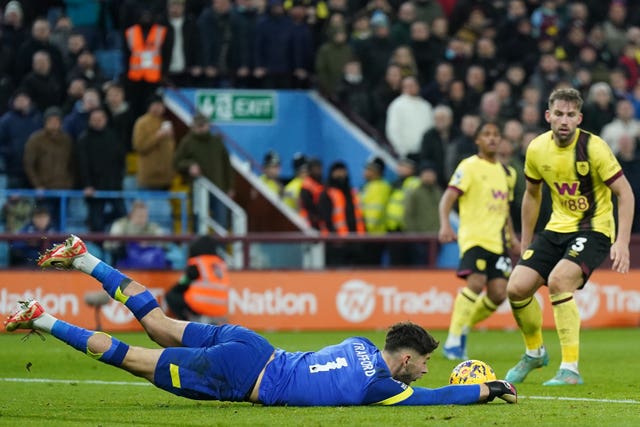 James Trafford dives to cut out an Aston Villa cross