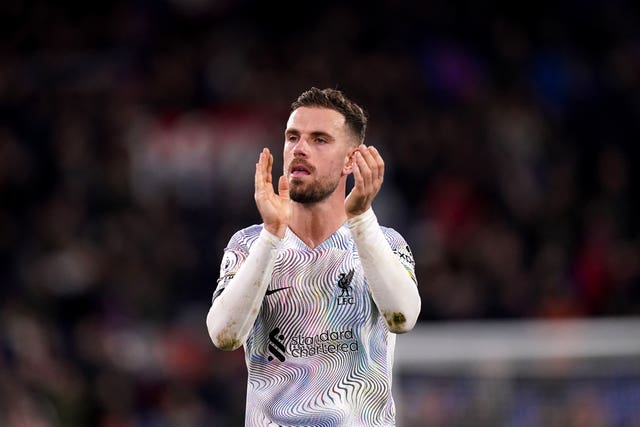Jordan Henderson applauds the fans at the final whistle