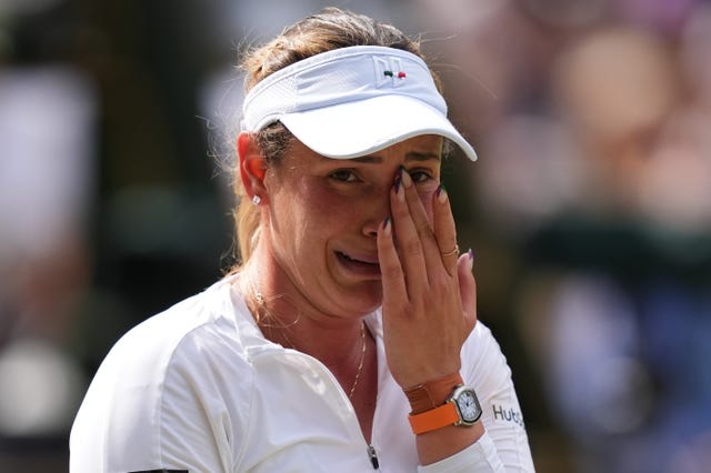 Donna Vekic wipes her left eye as she cries