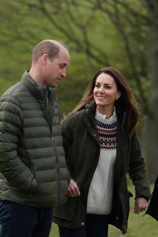 Duke and Duchess of Cambridge walk together at Manor Farm